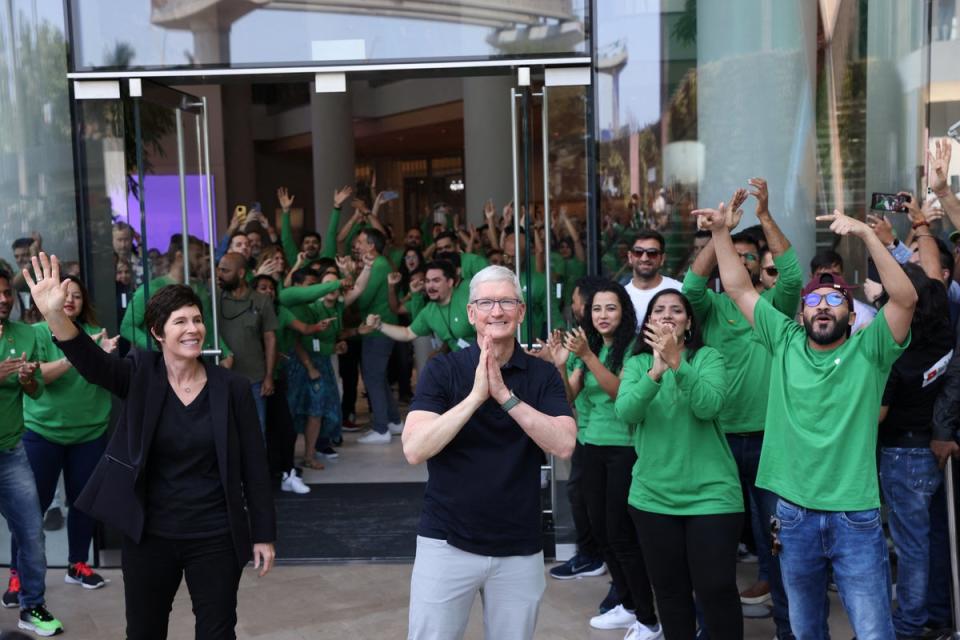 Apple CEO Tim Cook and Deirdre O’Brien, Apple’s senior vice president of Retail and People greet people at the inauguration of India’s first Apple retail store (REUTERS)