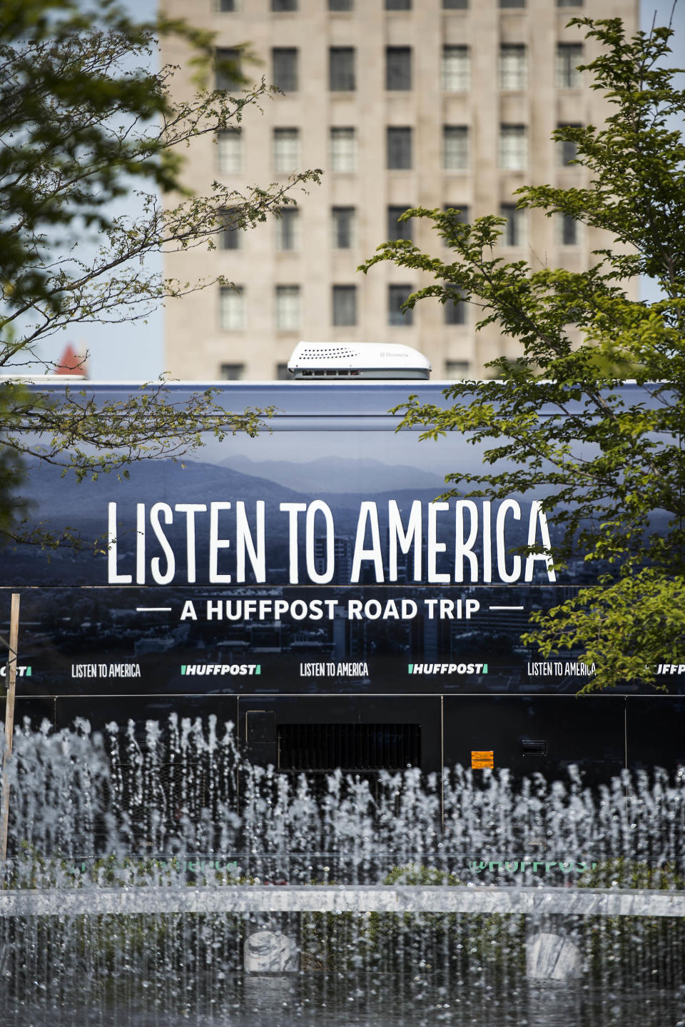 The HuffPost tour bus stops at Kiener Plaza Park near the Gateway Arch.