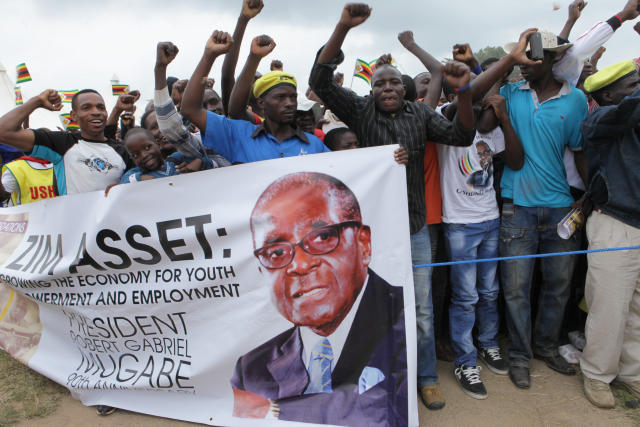 Supporters of President Robert Mugabe sing and dance during celebrations to mark his 90th birthday in Marondera about 100 km east of Harare, Sunday, Feb. 23, 2014. Mugabe who is Africas oldest leader has been in power in the Southern African nation since 1980. (AP (AP Photo/Tsvangirayi Mukwazhi)