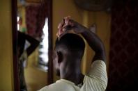 The Wider Image: A police raid, viral videos and the broken lives of Nigerian gay law suspects