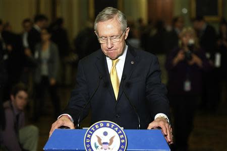 U.S. Senate Majority Leader Harry Reid (R-NV) pauses during remarks to reporters after their weekly party caucus lunch meeting at the U.S. Capitol in Washington, January 14, 2014. REUTERS/Jonathan Ernst