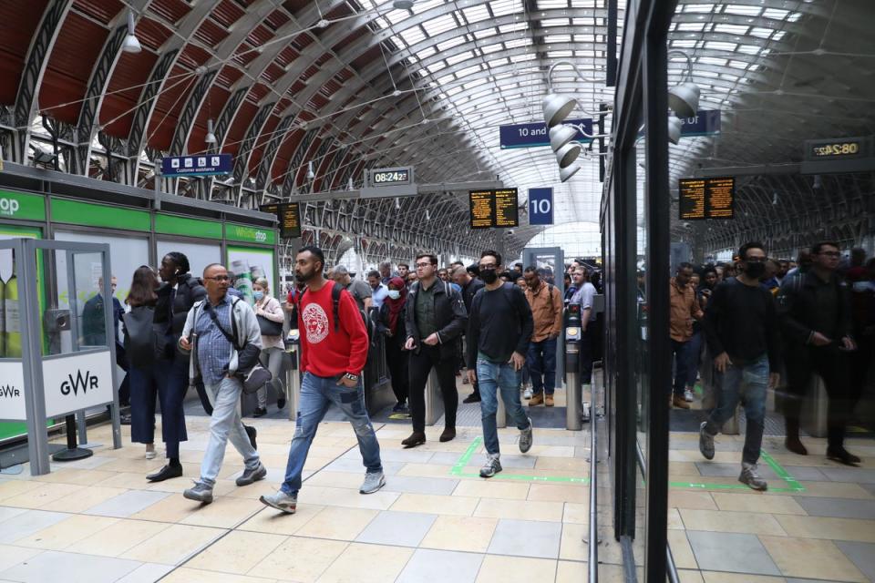 A flurry of passengers at Paddington station in London (Ashlee Ruggels/PA) (PA Wire)