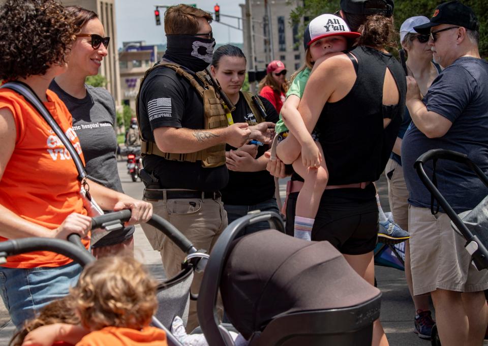 Demonstrators argue with gun owners who showed up armed and in tactical vests at the March for Our Lives protest in Nashville, Tenn. on Saturday, June 11, 2022. The march was part of a nationwide day of action advocating for stricter gun control laws.