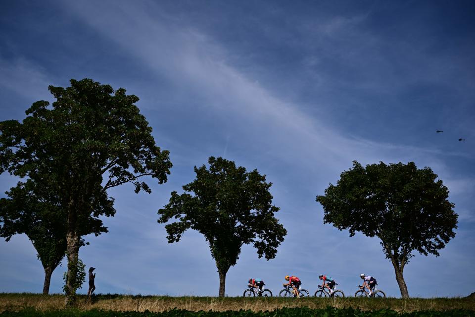 Lotto Dstny's Belgian rider Victor Campenaerts, Lotto Dstny's Dutch rider Pascal Eenkhoorn, Soudal Quick-Step's Danish rider Kasper Asgreen and Uno-X Pro Cycling Team's Norwegian rider Jonas Abrahamsen cycle in a breakaway during the 18th stage of the 110th edition of the Tour de France cycling race