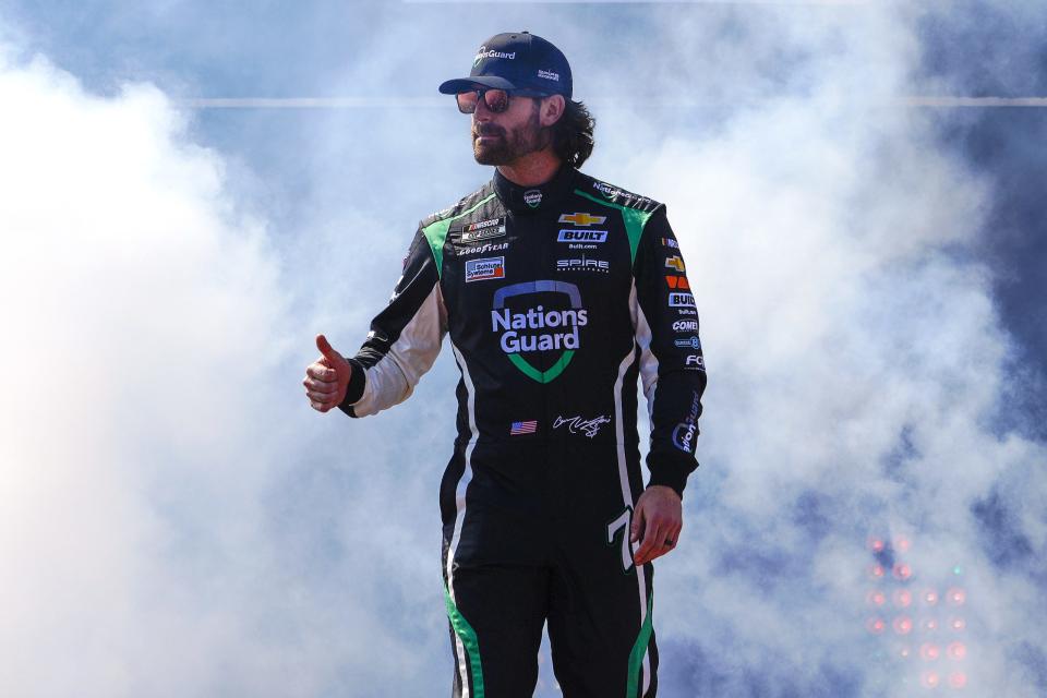 RICHMOND, VIRGINIA - APRIL 03: Corey LaJoie, driver of the #7 Nations Guard Chevrolet, waves to fans onstage during driver intros prior to the NASCAR Cup Series Toyota Owners 400 at Richmond Raceway on April 03, 2022 in Richmond, Virginia. (Photo by Jacob Kupferman/Getty Images) | Getty Images