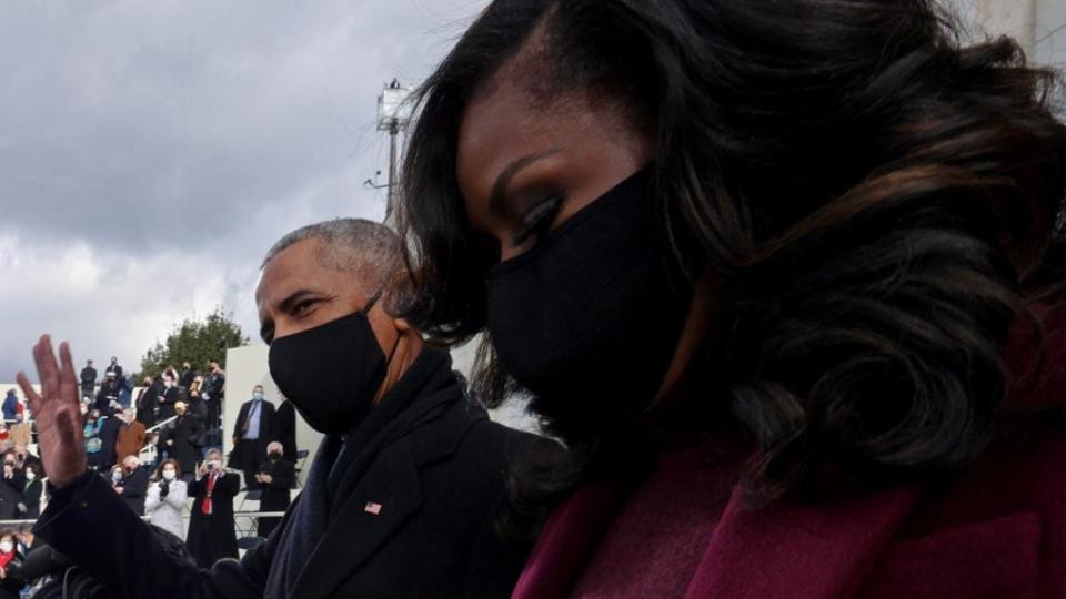 Former President and First Lady Barack and Michelle Obama arrive on the West Front of the U.S. Capitol for the inauguration of Joe Biden Wednesday. (Photo by Jonathan Ernst-Pool/Getty Images)