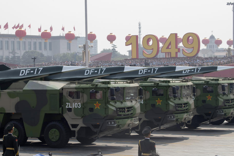 FILE - Chinese military vehicles carrying DF-17 roll during a parade to commemorate the 70th anniversary of the founding of Communist China in Beijing, Tuesday, Oct. 1, 2019. U.S. Defense Secretary Lloyd Austin said Thursday, Dec. 2, 2021, that China’s pursuit of hypersonic weapons “increases tensions in the region” and vowed the U.S. would maintain its capability to deter potential threats posed by China. (AP Photo/Ng Han Guan, File)