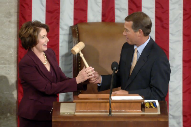 Incoming Speaking of the House Nancy Pelosi, D-Calif., receives the speaker's gavel from outgoing House Republican leader John Boehner, R-Ohio, as she becomes the first woman speaker of the House, in Washington on January 4, 2007. File Photo by Kevin Dietsch/UPI