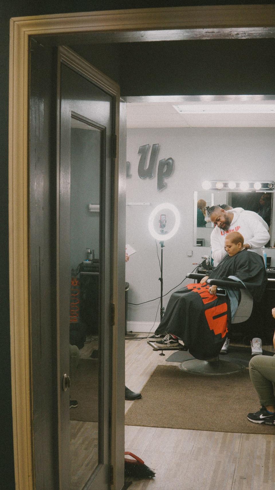As a barber, LaVonn Wilson knows how to talk to people inside of his barbershop.