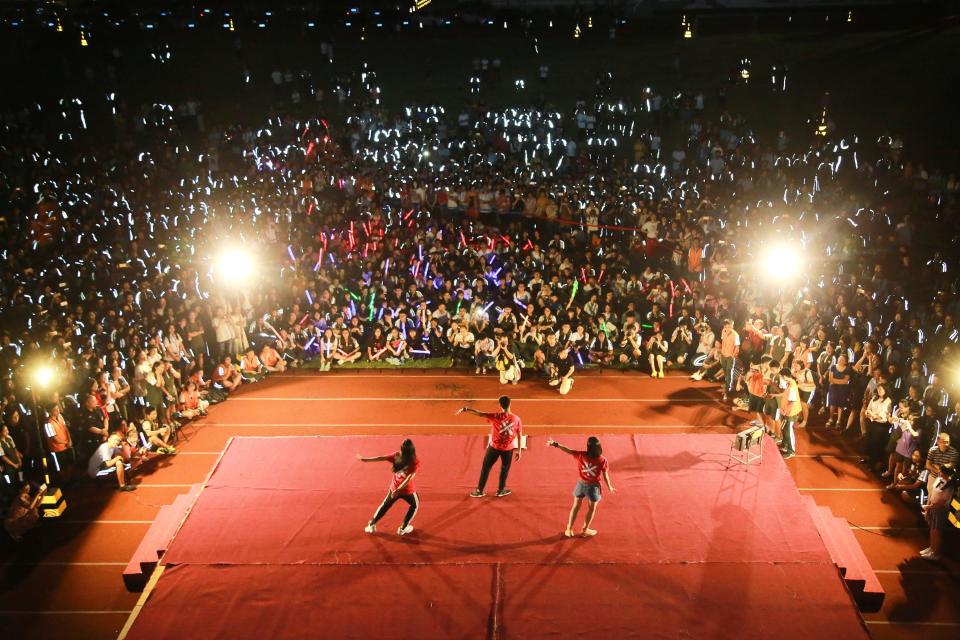 Students perform, to cheer for those who will participate in the annual national college entrance exam, or "gaokao", at a high school in Dongguan, Guangdong.