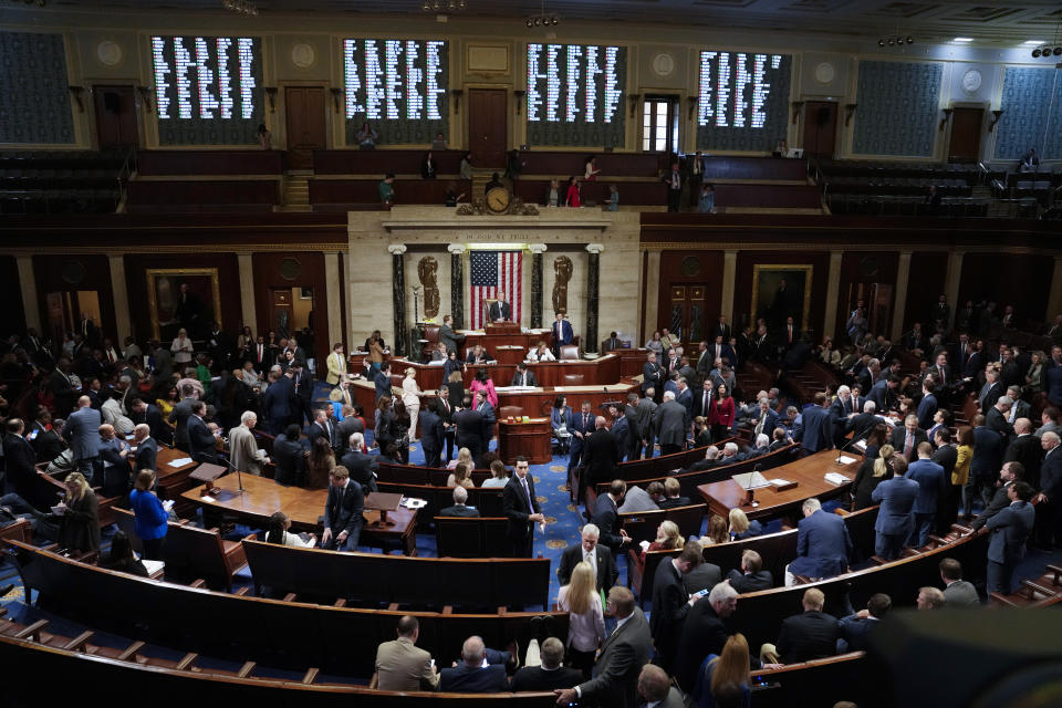 House Speaker Kevin McCarthy of Calif., stands center in the House Chamber, Thursday, May 11, 2023, at the Capitol in Washington, as House Republicans pass a sweeping bill to build more U.S.-Mexico border wall and impose new restrictions on asylum seekers. (AP Photo/Jacquelyn Martin)