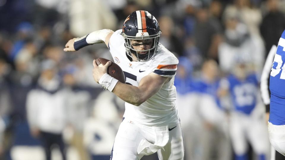 Virginia quarterback Brennan Armstrong runs the ball against BYU on Oct. 30.