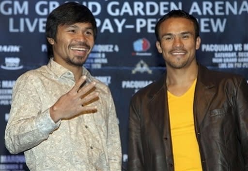 Manny Pacquiao (izq.) tiene un duro compromiso ante Juan M. Márquez (AP Photo/Seth Wenig)