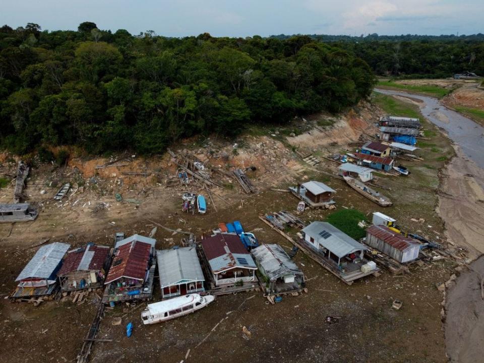 Floating houses and boats are seen stranded at the Marina do Davi, a docking area of the Negro river, city of Manaus, Amazonas State, northern Brazil