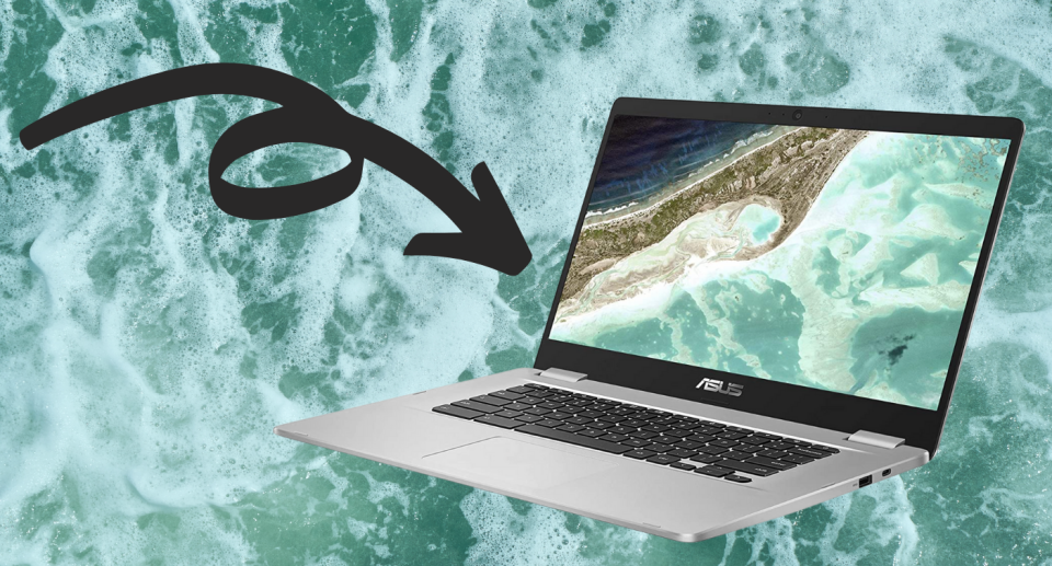 Asus chromebook laptop with ocean on screen with water background and black arrow 