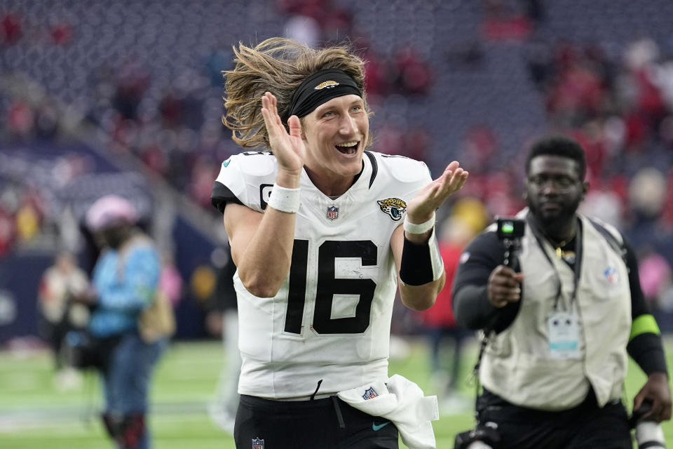 Jacksonville Jaguars quarterback Trevor Lawrence (16) celebrates as he jogs off the field after the teams NFL football game against the Houston Texans in Houston, Sunday, Nov. 26, 2023. (AP Photo/Eric Gay)
