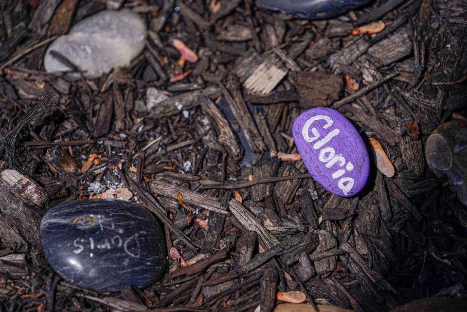 A rock garden remembers patients who passed from Huntington's disease on Thursday, May 12, 2022, at the Summerfield Health Care Center in Cloverdale Ind. Summerfield is the only long-term care facility in the US to exclusively treat those living with Huntington's disease. 