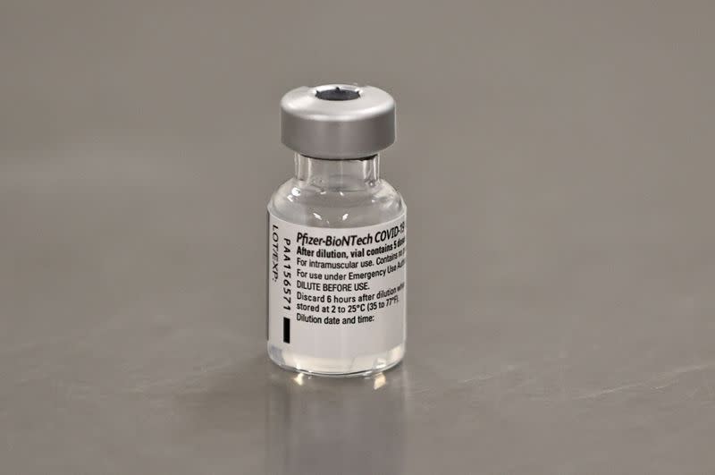 FILE PHOTO: A vial of the Pfizer/BioNTech COVID-19 vaccine is seen ahead of being administered at the Royal Victoria Hospital in Belfast