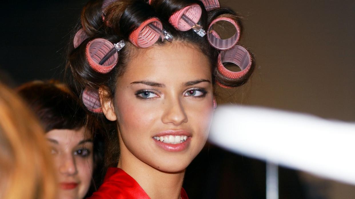 supermodel adriana lima with her hair in curlers backstage b