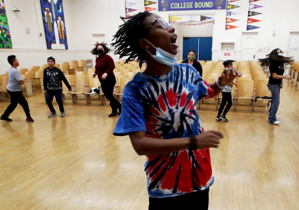 Students dance in a school