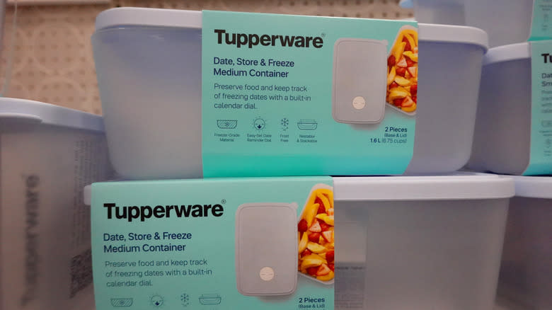 Two Tupperware containers on shelf