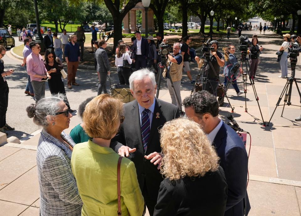 U.S. Rep. Lloyd Doggett, center, talks with, from left, state Reps. Lulu Flores, Sheryl Cole, Vikki Goodwin and Donna Howard and attorney Austin Kaplan after they spoke against House Bill 17 at Monday's news conference.
