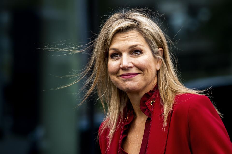 Queen Maxima fashioned a red power suit at a business forum in The Netherlands. Photo: Getty 