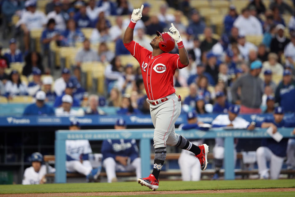 LOS ANGELES, CA - APRIL 15: Yasiel Puig #42 of the Cincinnati Reds reacts after hitting a home run in the first inning during the game between the Cincinnati Reds and the Los Angeles Dodgers at Dodger Stadium on Monday, April 15, 2019 in Los Angeles, California. (Photo by Rob Leiter/MLB Photos via Getty Images)