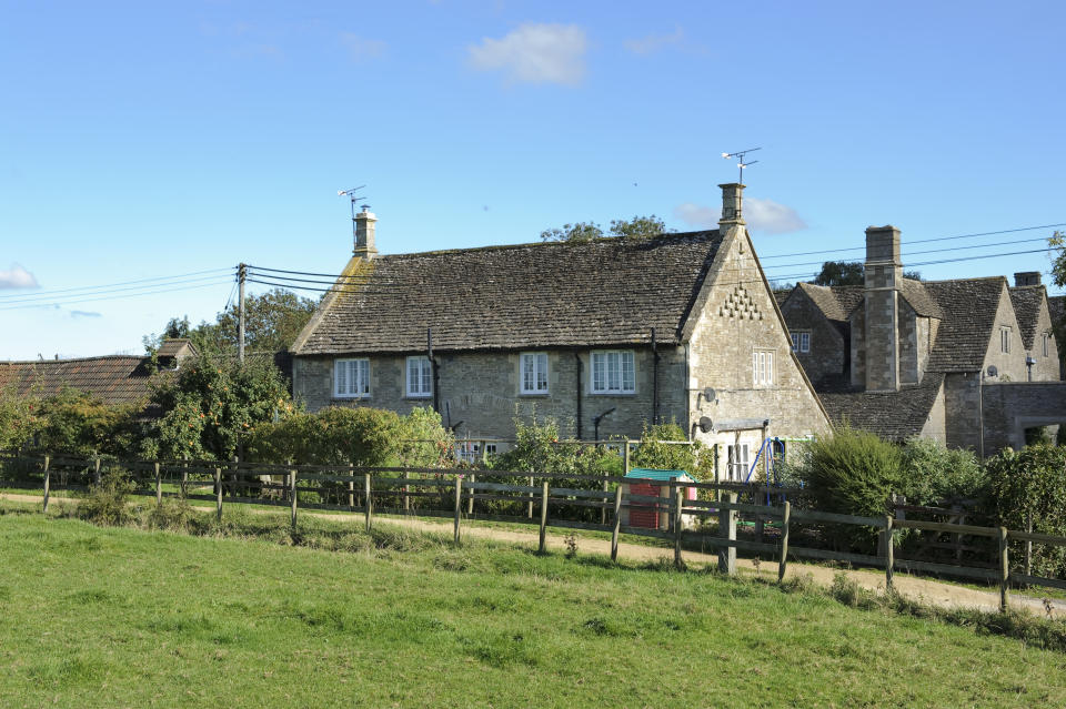 The manor grounds include cottages. (Savills)