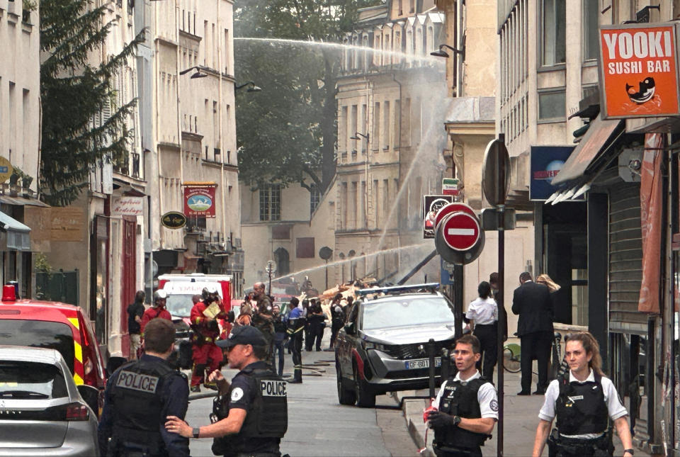 French police secure the area after several buildings caught on fire following a gas explosion in the fifth arrondissement of Paris, on June 21, 2023. / Credit: ANTONY PAONE/REUTERS