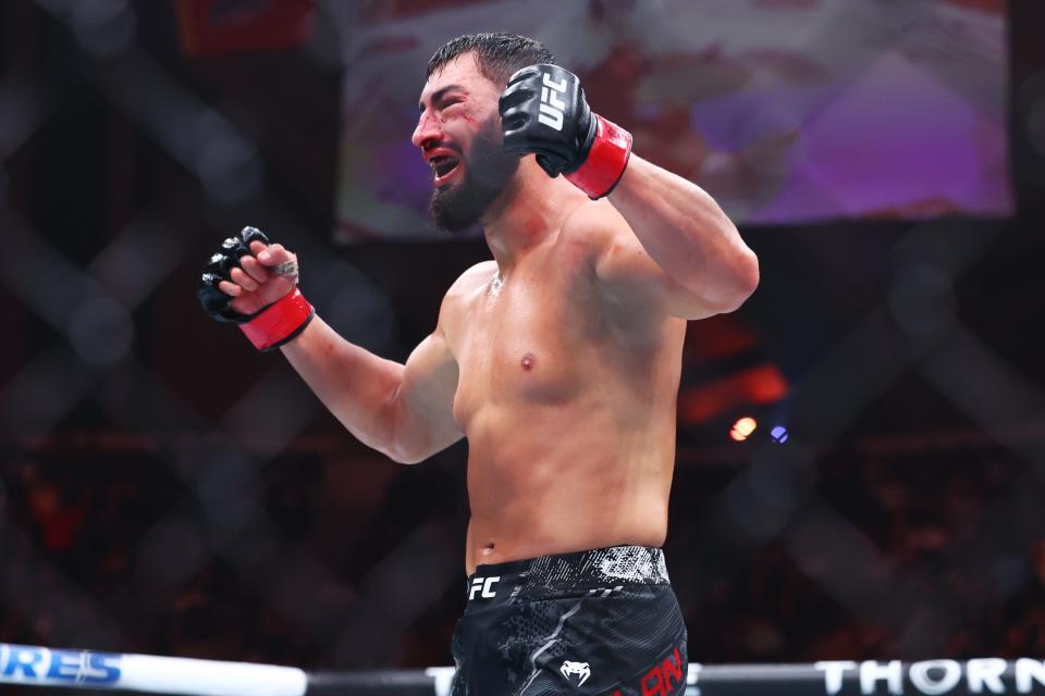 Mar 30, 2024; Atlantic City, New Jersey, USA; Ibo Aslan (red gloves) celebrates after defeating Anton Turkalj (not pictured) during UFC Fight Night at Boardwalk Hall. Mandatory Credit: Ed Mulholland-USA TODAY Sports