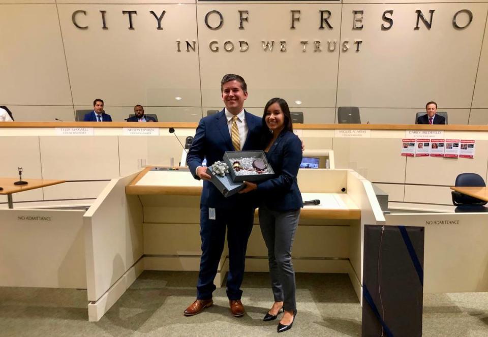 Former Council President Tyler Maxwell passes the gavel to incoming Council President Annalisa Perea on Jan. 11, 2024. Melissa Montalvo/Fresno Bee