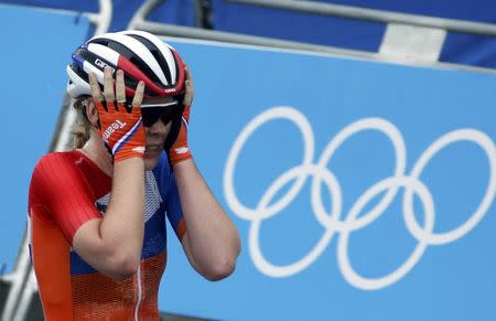 2016 Rio Olympics - Cycling Road - Final - Women's Road Race - Fort Copacabana - Rio de Janeiro, Brazil - 07/08/2016. Anna van der Breggen (NED) of Netherlands celebrates as she crosses the finish in the women's road race. REUTERS/Eric Gaillard