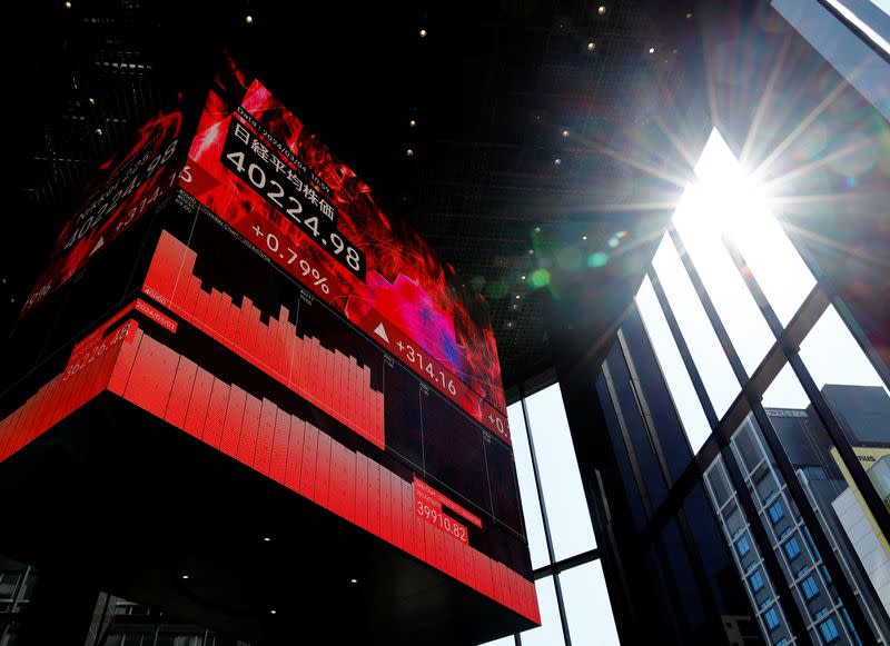 FILE PHOTO: An electronic screen displaying Japan's Nikkei share average is pictured in Tokyo