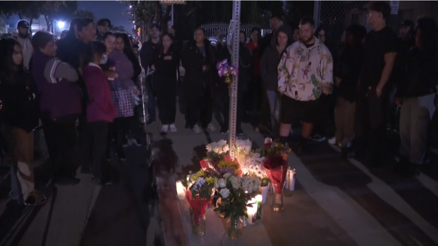 Flowers and candles are put out for the 14-year-old who was a victim in a random shooting spree that left four people dead.