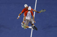 Bob (L) and Mike Bryan of the U.S. celebrate defeating Robin Haase and Igor Sijsling of Netherlands in their men's doubles final match at the Australian Open tennis tournament in Melbourne, January 26, 2013. REUTERS/David Gray (AUSTRALIA - Tags: SPORT TENNIS TPX IMAGES OF THE DAY) - RTR3CZCB