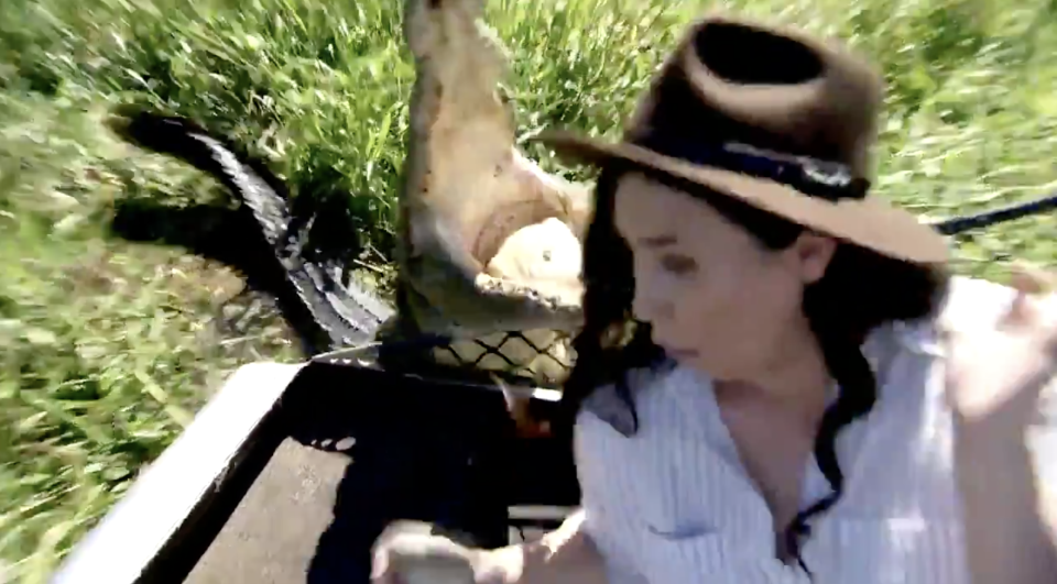 A crocodile named Bonecruncher snaps at 9News Darwin reporter Zarisha Bradley.