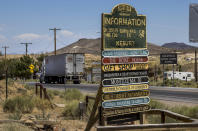 FILE - A semi truck makes its way into Goldfield, Nev., traveling north on I-95 and apart of Esmeralda County on Tuesday, Aug. 11, 2020. Elected officials in a rural Nevada county decided Thursday, June 23, 2022, to postpone until Friday certifying results of the 317 votes cast in their jurisdiction during the state's June 14 primary election. The decision in Nevada comes a week after lawmakers in a Republican-leaning rural New Mexico county initially refused to certify their primary election results. (L.E. Baskow/Las Vegas Review-Journal via AP, File)