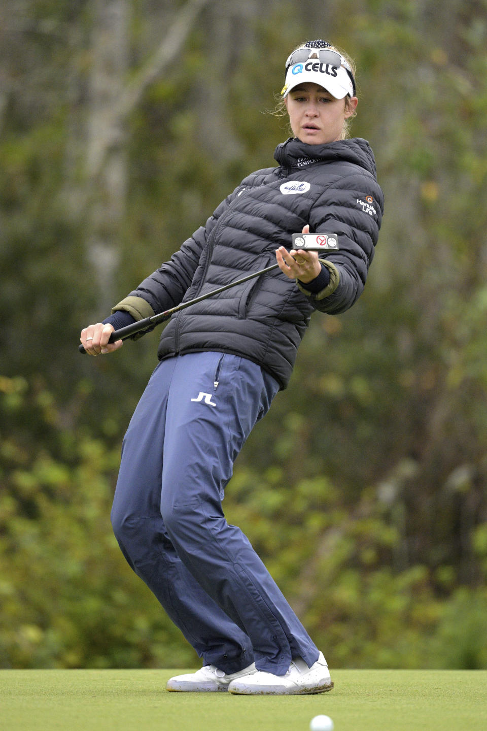 Nelly Korda reacts after barely missing a putt on the 16th green during the third round of the Tournament of Champions LPGA golf tournament, Saturday, Jan. 22, 2022, in Orlando, Fla. (AP Photo/Phelan M. Ebenhack)