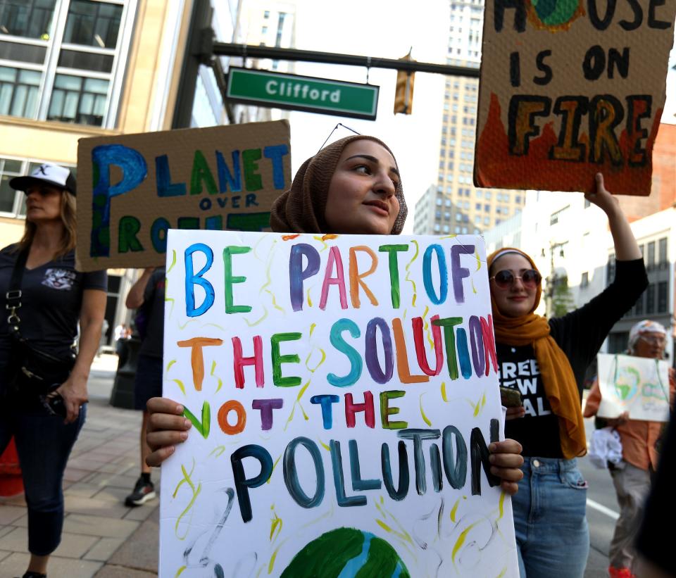 People from metro Detroit join together for a climate march.