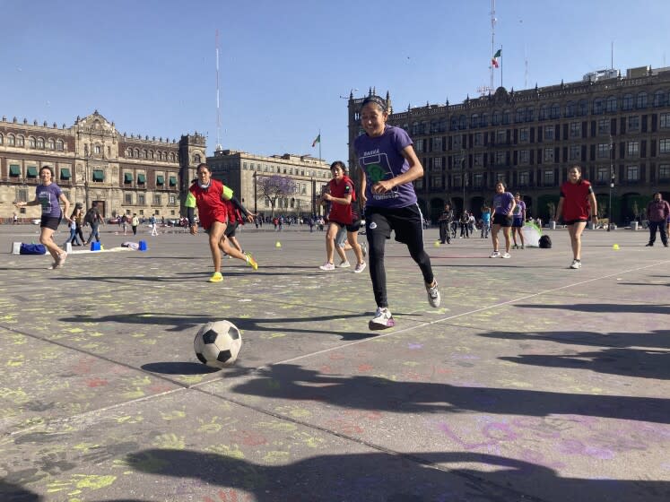 Female soccer groups play on Mexico City´s main square the Zocalo, to protest the machismo in the sport on Wednesday March 9, 2022.