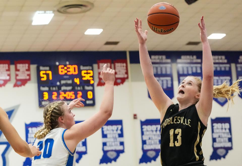 Noblesville Millers forward Ava Shoemaker (13) attempts to recover the ball against Hamilton Southeastern Royals forward Kayla Stidham (20) on Wednesday, Nov. 29, 2023, during the game at Hamilton Southeastern High School in Fishers. The Hamilton Southeastern Royals defeated the Noblesville Millers, 71-69.