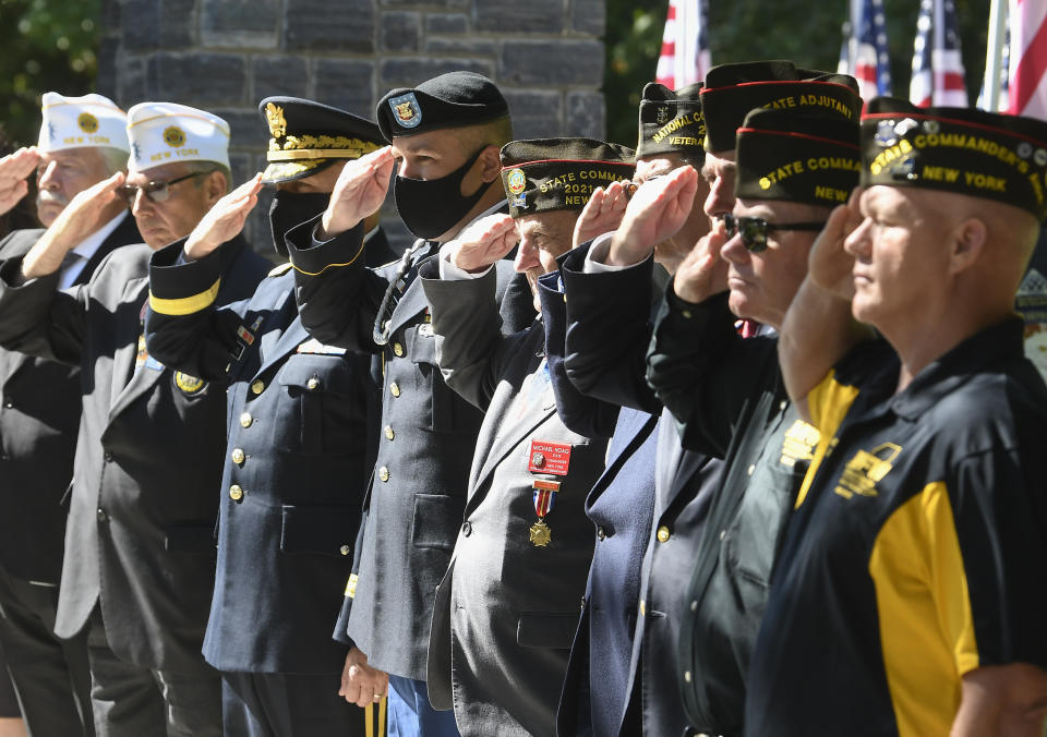 Veterans salute Korean War veteran Army Cpl. Walter Smead, a member of Battery A, 57th Field Artillery Battalion, 7th Infantry Division who was killed during the 1950 Battle of the Chosin Reservoir, is laid to rest with full military honors at Gerald B. H. Solomon Saratoga National Cemetery, on Monday, Sept. 20, 2021, in Schuylerville, N.Y. Korean War veteran Army Cpl. Walter Smead, a member of Battery A, 57th Field Artillery Battalion, 7th Infantry Division who was killed during the 1950 Battle of the Chosin Reservoir, is laid to rest with full military honors at Gerald B. H. Solomon Saratoga National Cemetery, on Monday, Sept. 20, 2021, in Schuylerville, N.Y. Smead was finally laid to rest near his rural upstate New York hometown, seven decades after he was killed in the Korean War and months after his remains were finally identified with help from DNA analysis. (AP Photo/Hans Pennink)