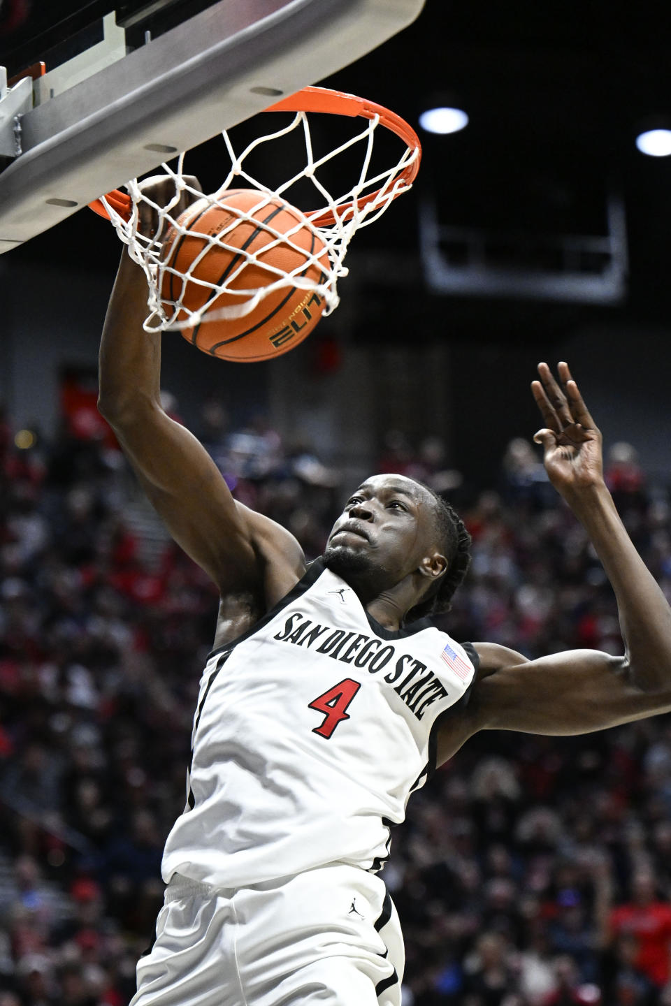 San Diego State forward Jay Pal dunks during the first half of an NCAA college basketball game against Utah State, Saturday, Feb. 3, 2024, in San Diego. (AP Photo/Denis Poroy)