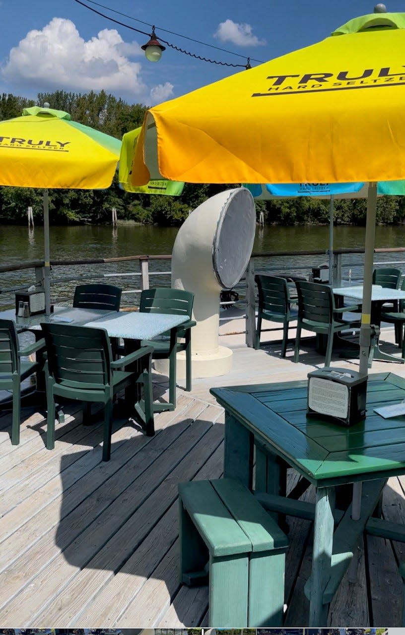 The deck area is shown at Curtin's Wharf restaurant in Burlington City. The restaurant is located along the Delaware River.