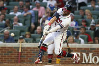 Atlanta Braves' Robbie Grossman hits a single during the third inning of the team's baseball game against the New York Mets, Thursday, Aug. 18, 2022, in Atlanta. (AP Photo/Brett Davis)