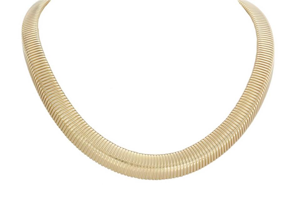 London Collection <a href="https://www.londonjewelers.com/london-collection-14k-yellow-gold-tubogas-choker-necklace" rel="nofollow noopener" target="_blank" data-ylk="slk:tubogas choker necklace;elm:context_link;itc:0;sec:content-canvas" class="link ">tubogas choker necklace</a>, $3,455 at London Jewelers