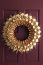 <p>These wreath will make you feel grateful every day, since it holds family members' declarations of gratitude.</p><p><strong><a href="https://www.womansday.com/home/crafts-projects/how-to/a5356/thanksgiving-craft-paper-cone-gratitude-wreath-112583/" rel="nofollow noopener" target="_blank" data-ylk="slk:Get the tutorial;elm:context_link;itc:0;sec:content-canvas" class="link ">Get the tutorial</a>.</strong></p>