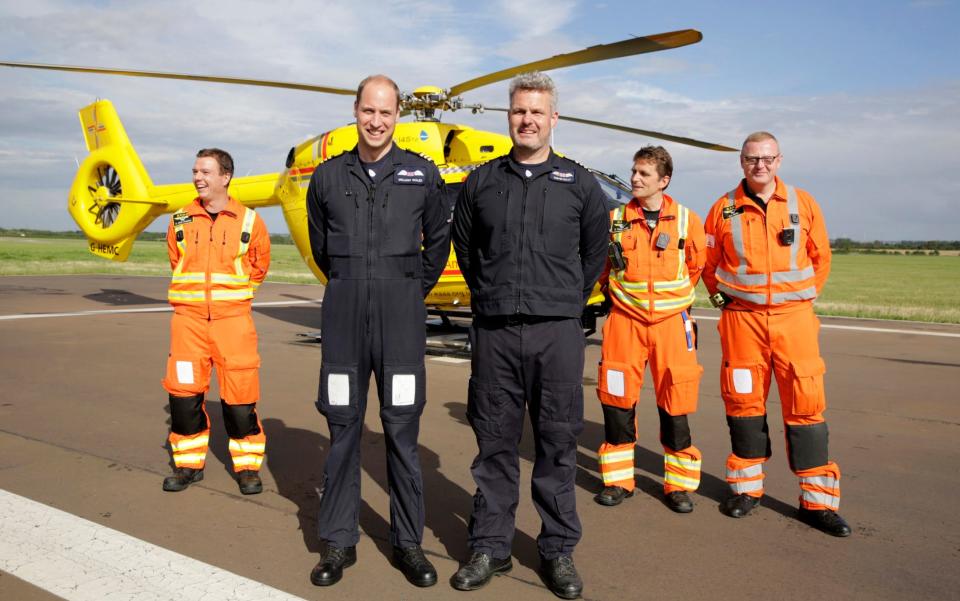  Prince William, Duke of Cambridge (2L) starts his final shift with the East Anglian Air Ambulance - Credit: Heathcliff O'Malley