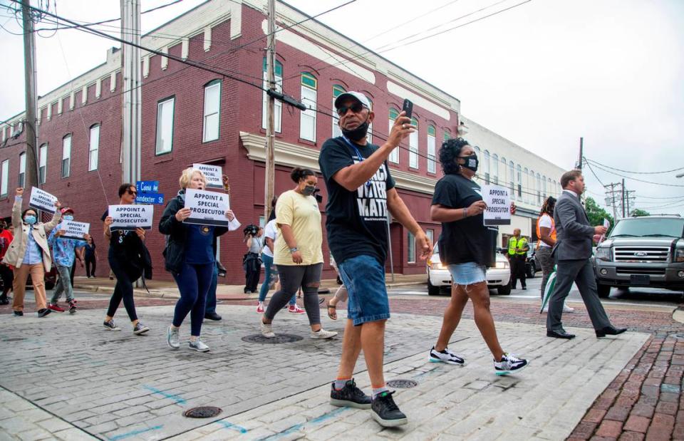 Around 150 demonstrators march Saturday, June 12, 2021 in Elizabeth City calling for a special prosecutor and the release of body-camera footage in the April slaying of Andrew Brown Jr.